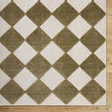 Close-up of Bosley Olive Washable Area Rug. Features a diamond pattern in olive green and off-white on a textured, machine-woven pile. Corner