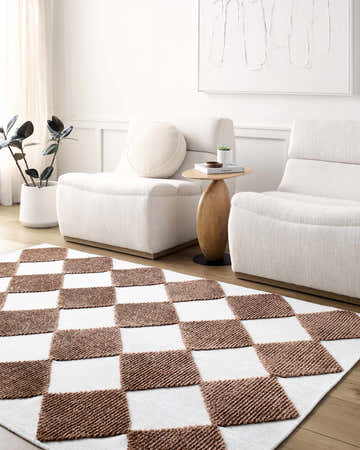 Living room scene with white chairs and Bosley Brown Washable Area Rug in a checkerboard pattern. Roomscene-Rectangle