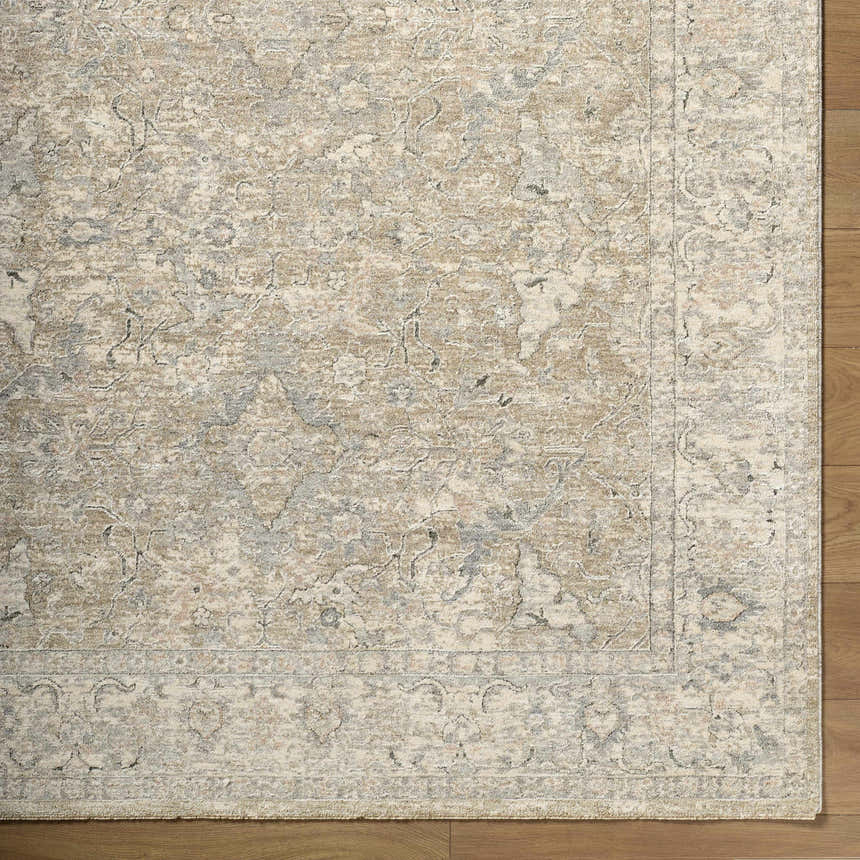 Close up of Brynja Cream Area Rug showing traditional pattern and texture on hardwood floor. Corner