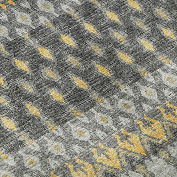 Close-up of Dalyn Brisbane BR1 Pewter Washable Area Rug. Gold, gray, and taupe casual rug with a geometric pattern.