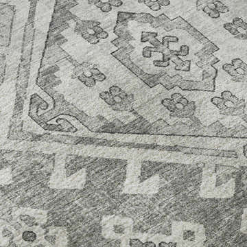 Close-up of the Dalyn Brisbane BR2 Silver Washable Area Rug, showcasing its beige, medium gray, and silver gray geometric pattern.