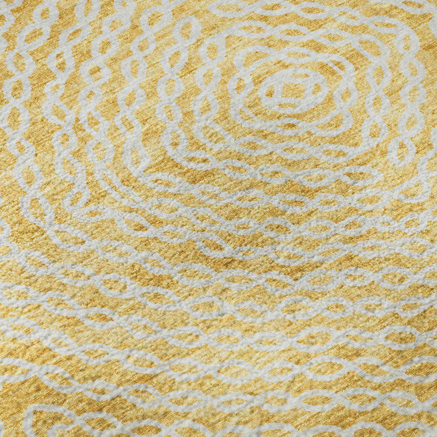 Close-up of Dalyn Brisbane BR3 Gold Washable Area Rug featuring a textured beige and gold geometric pattern.