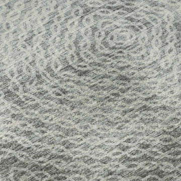 Close-up of the Dalyn Brisbane BR3 Metal Washable Area Rug, showing a beige, silver gray, and taupe geometric pattern.