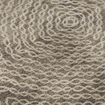 Close-up of the Dalyn Brisbane BR3 Mink Washable Area Rug, featuring a beige and brown circular pattern.