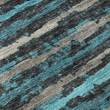 Close-up of Dalyn Brisbane BR4 Teal Washable Area Rug. Features a casual striped pattern in teal, black, ivory, and taupe.