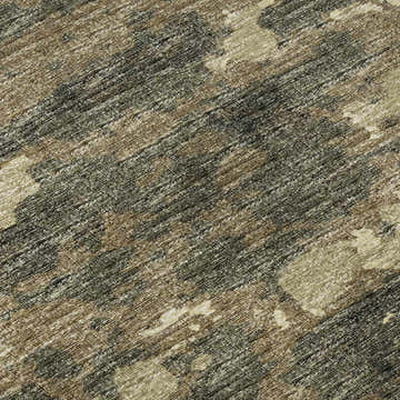 Close-up of Dalyn Brisbane BR5 Desert Washable Area Rug. Beige, light brown, and olive tones with a textured, casual pattern.