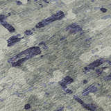 Close-up of the Dalyn Brisbane BR5 Eggplant Washable Area Rug. Features a taupe background with dark purple abstract shapes.