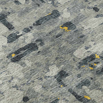 Close-up of the Dalyn Brisbane BR5 Gold Washable Area Rug. Features a gold, taupe, and yellow abstract pattern.