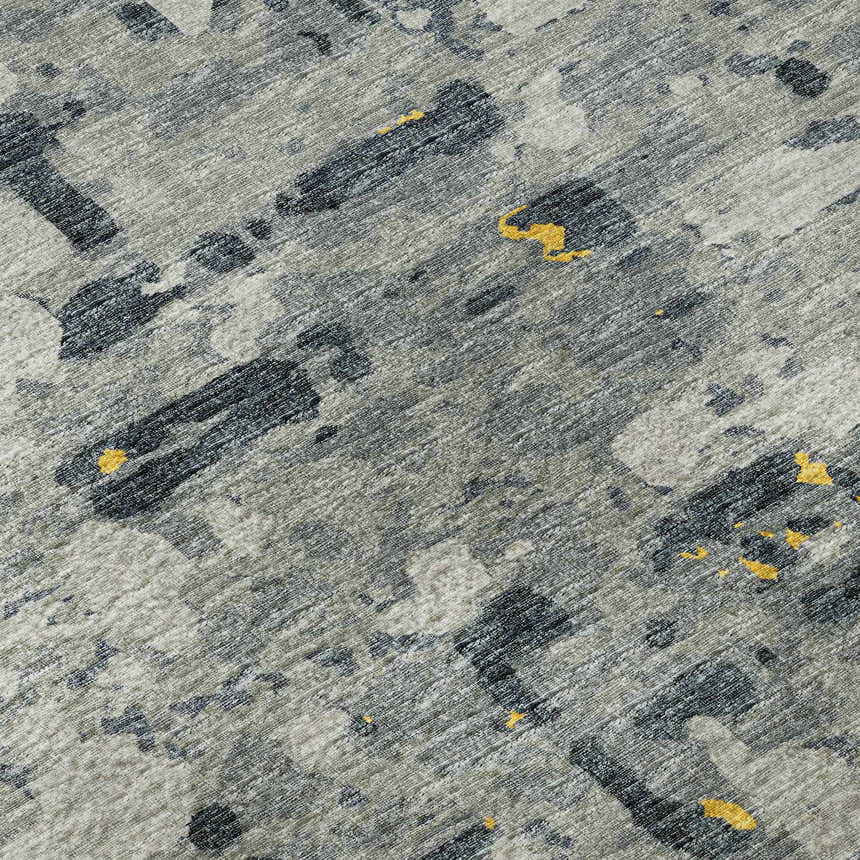 Close-up of the Dalyn Brisbane BR5 Gold Washable Area Rug. Features a gold, taupe, and yellow abstract pattern.