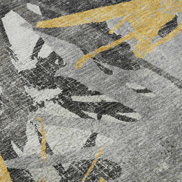 Close-up of Dalyn Brisbane BR6 Gold Washable Area Rug. Abstract pattern in gold, taupe, and yellow. Machine-made texture.