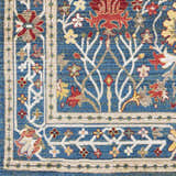 Close-up of the Livabliss Crafty Surya CRT-2308 Area Rug. Features a blue, burgundy, and tan floral pattern. Swatch