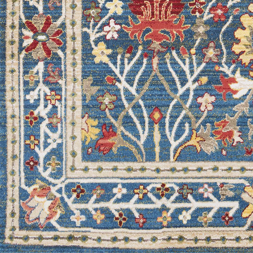Close-up of the Livabliss Crafty Surya CRT-2308 Area Rug. Features a blue, burgundy, and tan floral pattern. Swatch