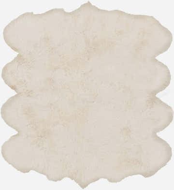 Close-up of a soft, ivory Premium White Soft Sheepskin Rug with a shaggy texture and unique, scalloped edge. Design-Custom