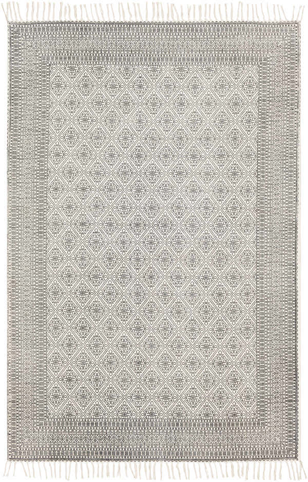 Close-up of the Brushton Area Rug. Hand-woven cotton rug in beige and black with a diamond and floral pattern and fringed edges. Design-Rectangle-576