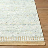 Close-up of the hand-woven Andrey Dark Beige area rug, showing wool texture, beige border, and subtle charcoal, brown, and yellow flecks. Front