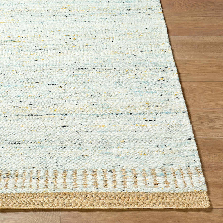 Close-up of the hand-woven Andrey Dark Beige area rug, showing wool texture, beige border, and subtle charcoal, brown, and yellow flecks. Front