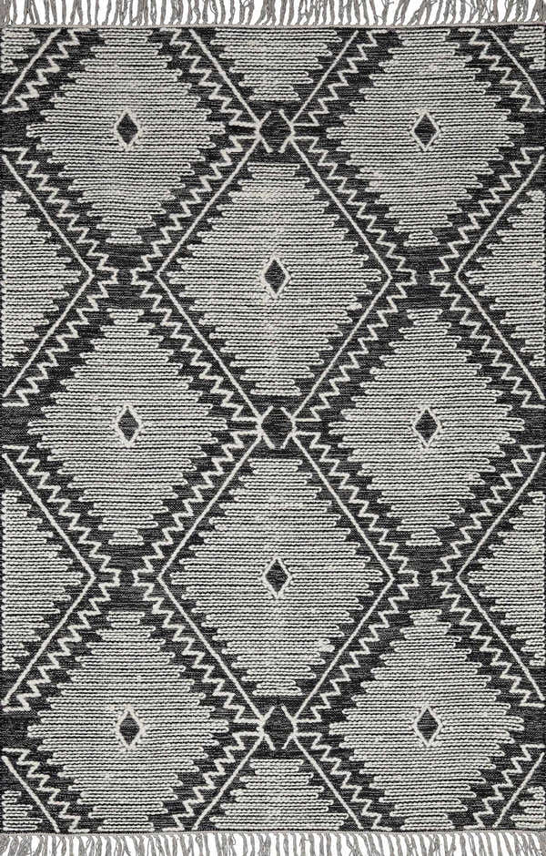 Close-up of the Brownhills rug. Hand woven cotton and wool rug with black and cream geometric diamond pattern. Design-Rectangle