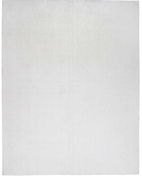 Close-up of the white Brownsdale Area Rug, a hand-loomed polyester rug with a subtle texture. Design-Rectangle