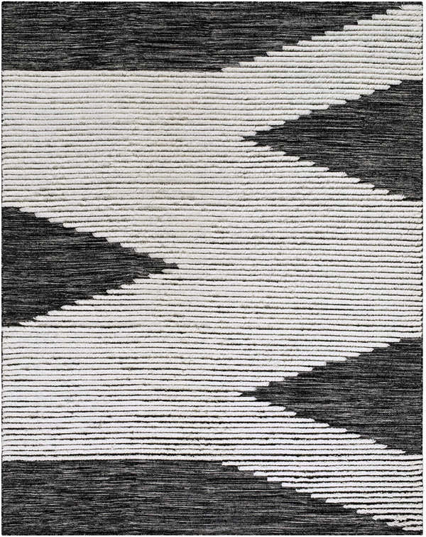 Close-up of the hand-woven Bushwick Area Rug. Black and cream wool forms a geometric, striped pattern. Design-Rectangle-810