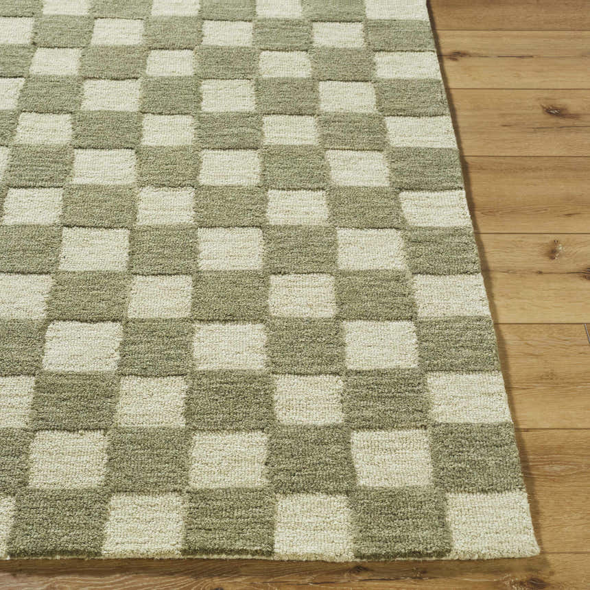 Close up of the Amparo Olive Area Rug showing a beige and olive checkerboard pattern and wool texture. Front