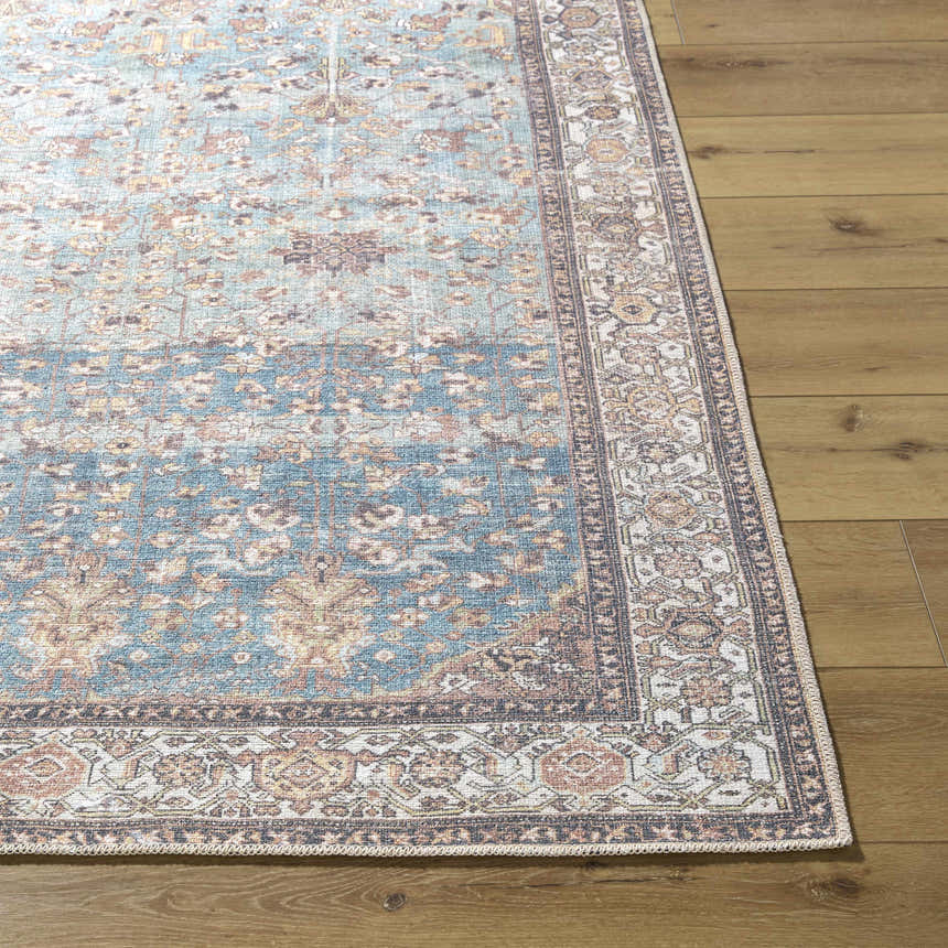 Close-up of the Bahram Vintage Flat Pile Washable Rug; teal, cream, and dark red traditional pattern on a wood floor. Front