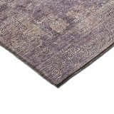 Close-up of the Dalyn Luxury Burano BU10 Plum Washable Area Rug, showcasing its purple, chestnut, and light purple tones.