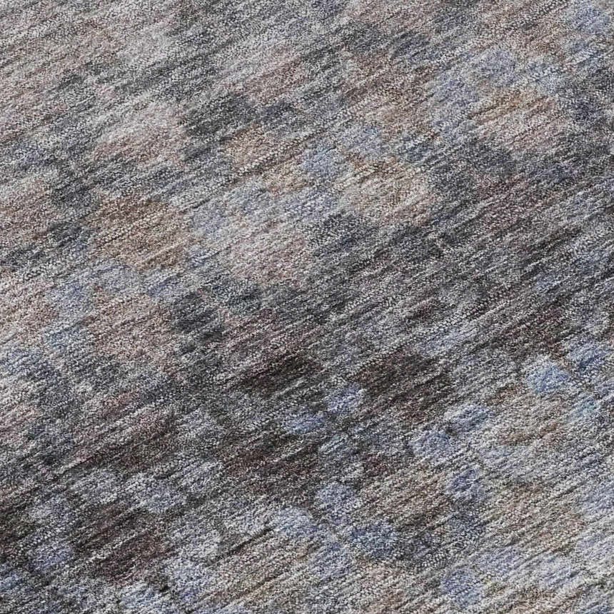 Close-up of the Dalyn Luxury Burano BU6 Brown Washable Area Rug, featuring beige, brown, and gray tones with a subtle textured pattern.