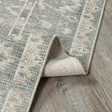 Close-up of the beige and gray Collins Avenue I Vintage Oushak Area Rug showing its traditional pattern and machine-woven texture. Fold