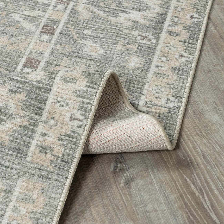 Close-up of the beige and gray Collins Avenue I Vintage Oushak Area Rug showing its traditional pattern and machine-woven texture. Fold