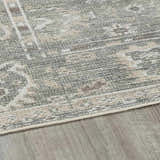 Close-up of the Collins Avenue I Vintage Oushak Area Rug showing beige, gray, and brown tones and traditional pattern. Pile