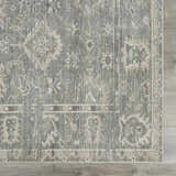 Close-up of the Collins Avenue I Vintage Oushak Area Rug. Features a traditional beige, gray, and brown pattern. Swatch