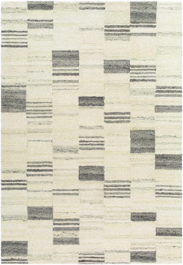 Close-up of Max Handmade Becki Owens x LIVABLISS BOMX-2305 Area Rug. Ivory wool rug with ash, blue, and charcoal block pattern. Design-Rectangle-576