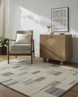 Living room scene with Becki Owens x LIVABLISS BOMX-2305 rug in ash, blue, charcoal, cream, and ivory colors. Roomscene-Rectangle