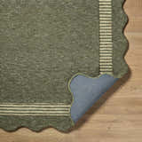 Close-up of Wone Green Border Hand Tufted Wool Area Rug showing texture, striped border, scalloped edge, and backing. Fold