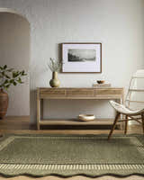 Entryway scene with the Wone Green Border Hand Tufted Wool Area Rug, console table, art, and chair. Neutral color palette. Roomscene-Rectangle