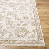 Close-up of the Chyron Cream Area Rug, a traditional rug with cream, tan, and light brown floral patterns. Front
