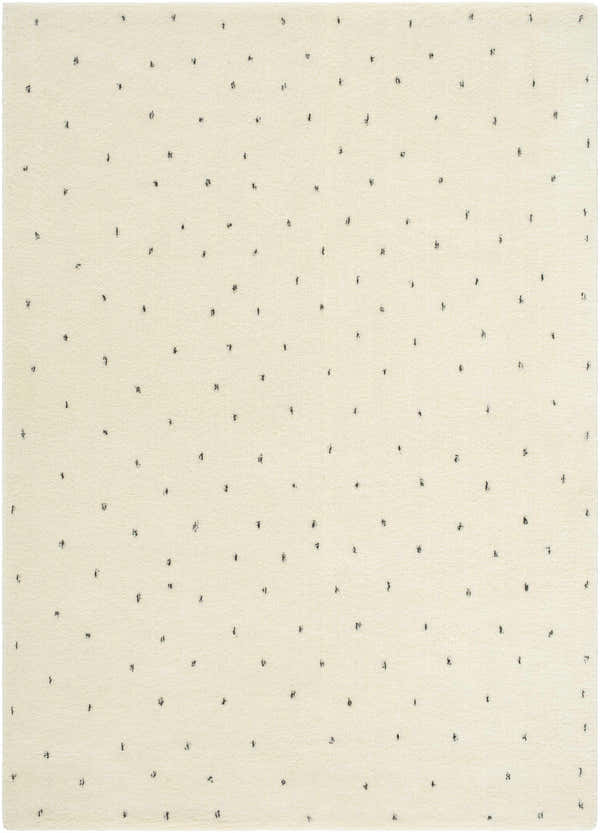Close-up of the Cirila Dotted Ivory Washable Wool Rug. Features a soft ivory background with small, charcoal-colored dotted pattern. Design-Rectangle-57