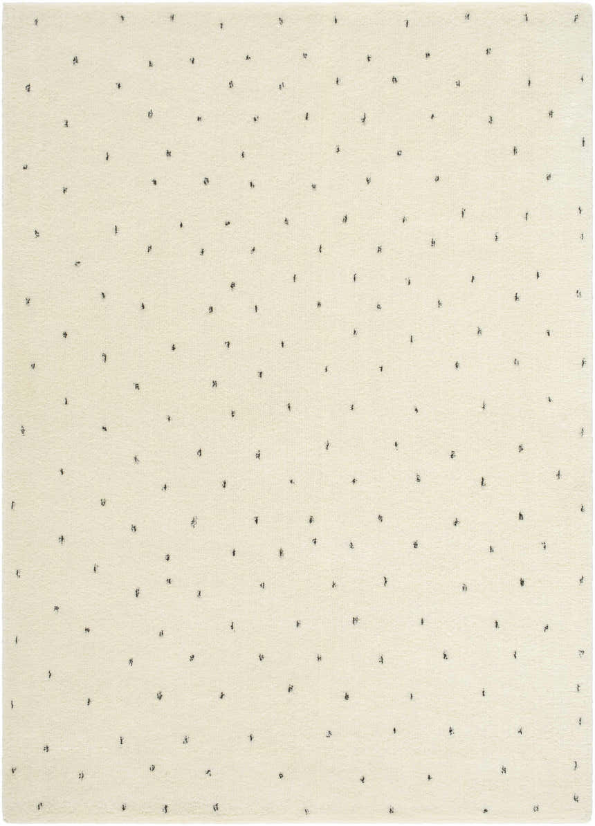 Close-up of the Cirila Dotted Ivory Washable Wool Rug. Features a soft ivory background with small, charcoal-colored dotted pattern. Design-Rectangle-57