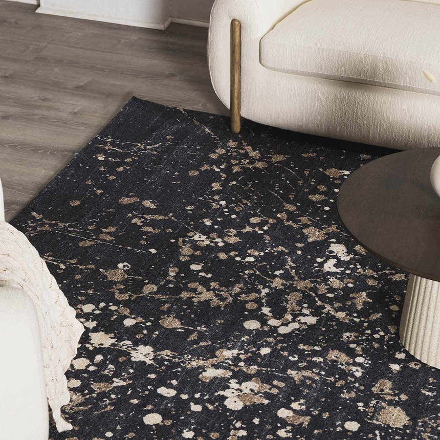 Close-up of the Janek Handmade Galey Alix x LIVABLISS GAJA-2300 Area Rug featuring a charcoal base with ivory and taupe splatter design. Roomscene-Rectangle