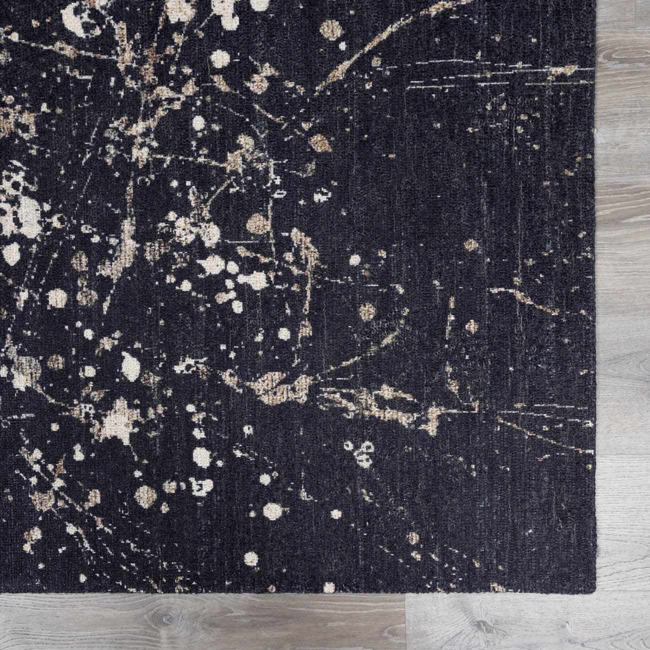 Close-up of Janek Handmade Galey Alix x LIVABLISS GAJA-2300 Area Rug. Charcoal rug with ivory and taupe splatter design. Swatch