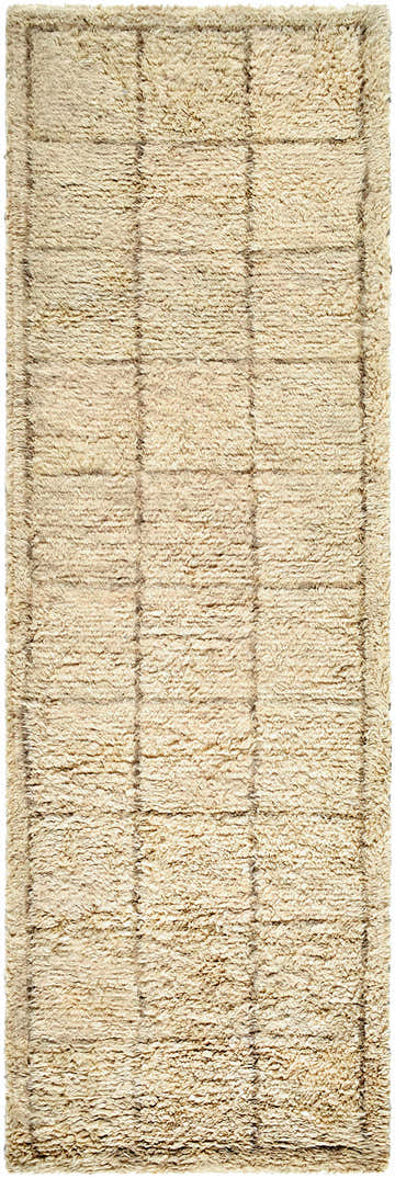 Close up of the Alodie Grid Wool Rug showing its tan color and hand tufted texture. Design-Runner-268