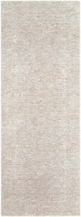 Close-up of the Catrin Area Rug, a machine-woven rug in light sage, light slate, and slate blue with a subtle traditional pattern. Design-Runner-2710