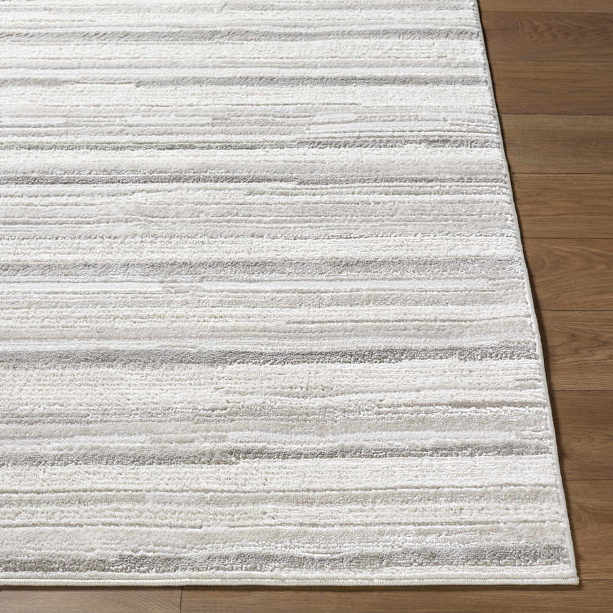 Close-up of the Cardea Area Rug showing its cream, ivory, and gray horizontal striped design and soft texture. Front