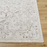 Close-up of the Corina Charcoal Area Rug showing its traditional cream, tan, and gray floral pattern and soft texture. Front