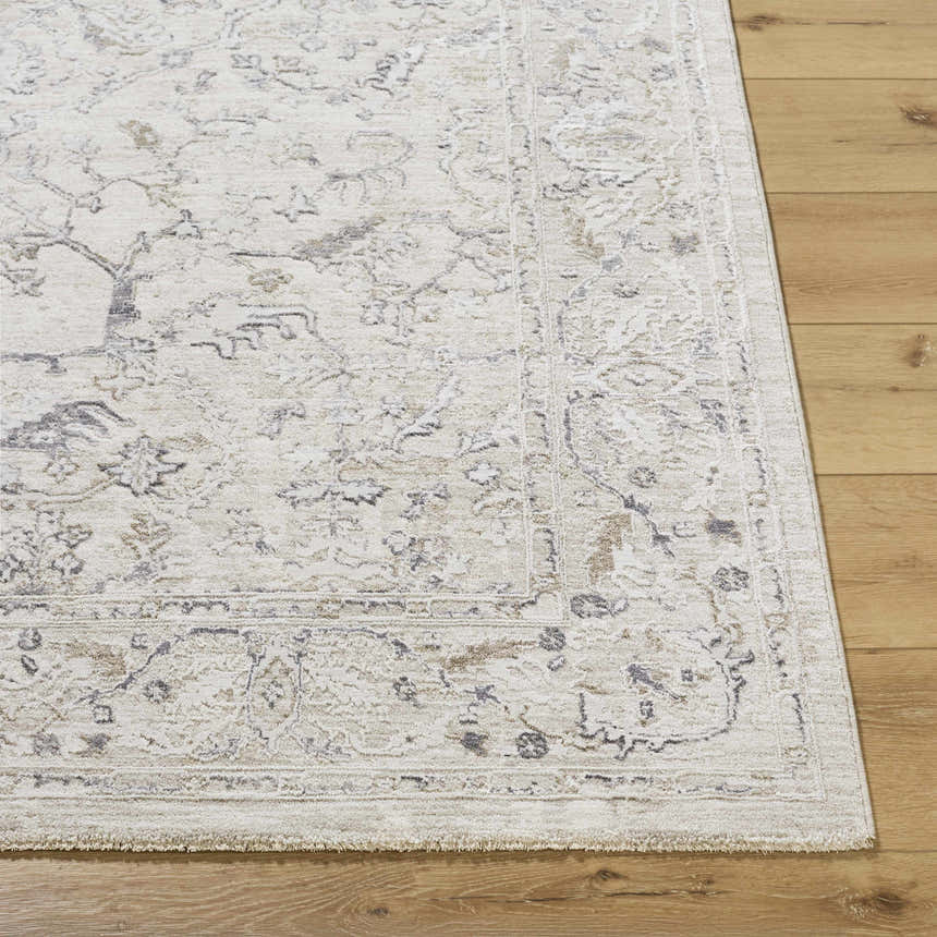 Close-up of the Corina Charcoal Area Rug showing its traditional cream, tan, and gray floral pattern and soft texture. Front