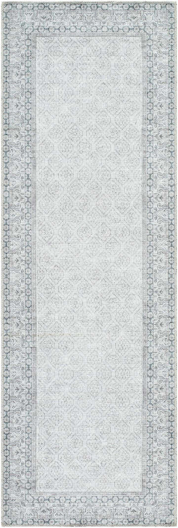 Close-up of Rainier Cottage Border Gray Washable Rug. Farmhouse style rug with blue border and geometric pattern. Design-Runner-27710