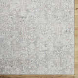 Close-up of the Carlyn Area Rug. Cream, light sage, light slate, sage, and tan farmhouse traditional floral pattern. Swatch