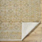 Close-up of Becki Tan Owens x Livabliss Renaissance Area Rug showing beige, tan, and taupe traditional pattern. Fold