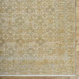 Close-up of Becki Tan Owens x Livabliss Renaissance Area Rug. Beige, tan, and taupe traditional floral pattern. Corner