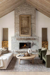 Living room scene with fireplace and Lorelai Vivir x LIVABLISS rug in dark red, denim, light sage, and tan colors. Farmhouse style. Styleshot
